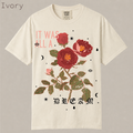Shop It Was All A Dream rose tee. Vintage gothic floral graphic with celestial details, distressed aesthetic on soft garment-dyed cotton. Alternative floral shirt.
