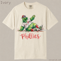 Philadelphia Phillies mascot watercolor shirt. Cute green mascot sliding into base, Phillies script baseball fan tee on soft garment-dyed cotton.